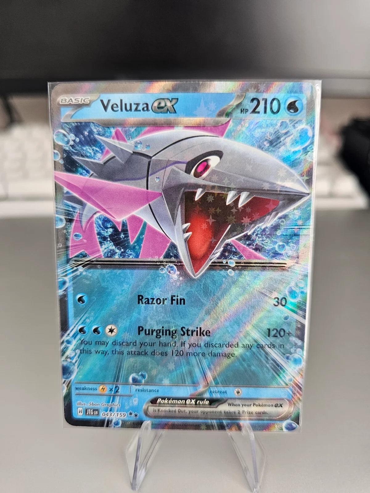 Veluza ex 043/159 · Holofoil (Journey Together)