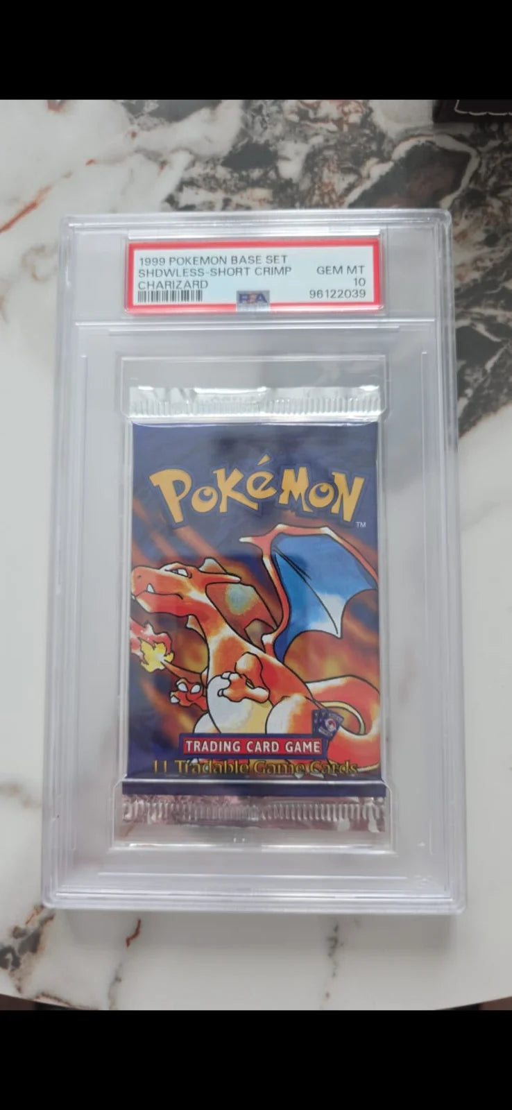 1999 Pokémon Base Set Shadowless Short Crimp Charizard Booster Pack PSA 10