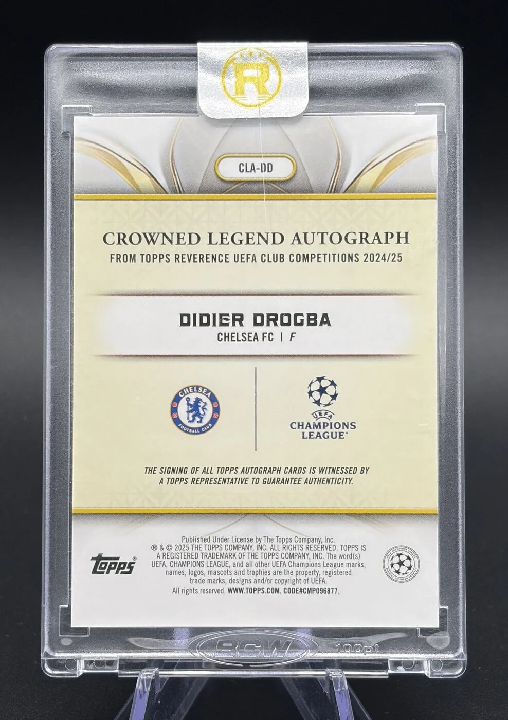 2024-25 Topps Reverence UCC Didier Drogba Crowned Legend Auto Red 1/5 First On Print #CLA-DD Chelsea