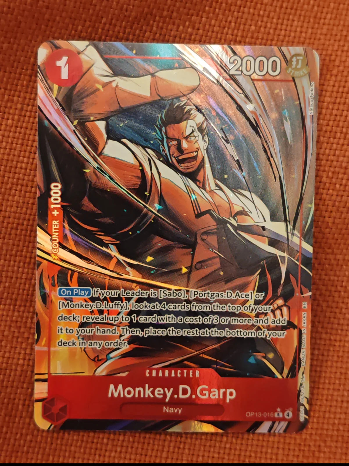 Monkey.D.Garp (Alternate Art) OP13-016 (Carrying On His Will)