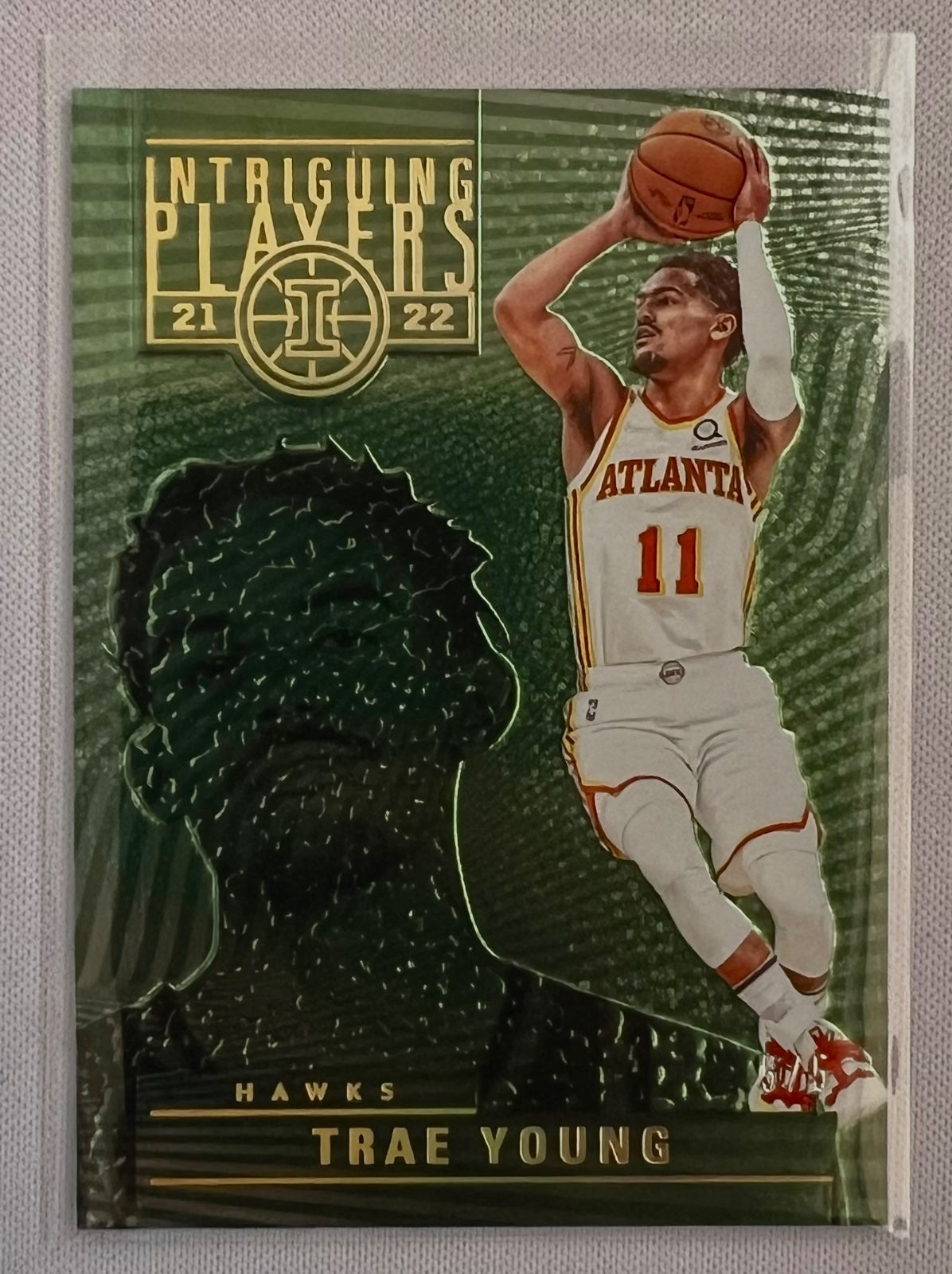 2021-22 Panini Illusions #12 Trae Young Intriguing Players /5