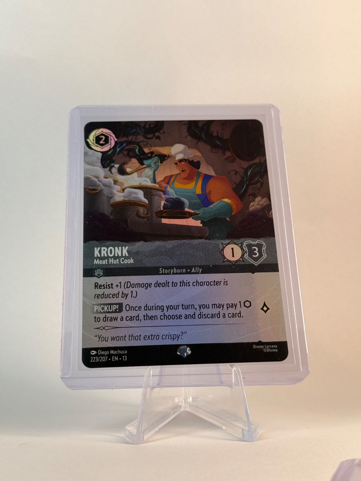 Disney Lorcana Kronk – Meat Hut Cook #223/207 Epic Holo Attack of the Vine!