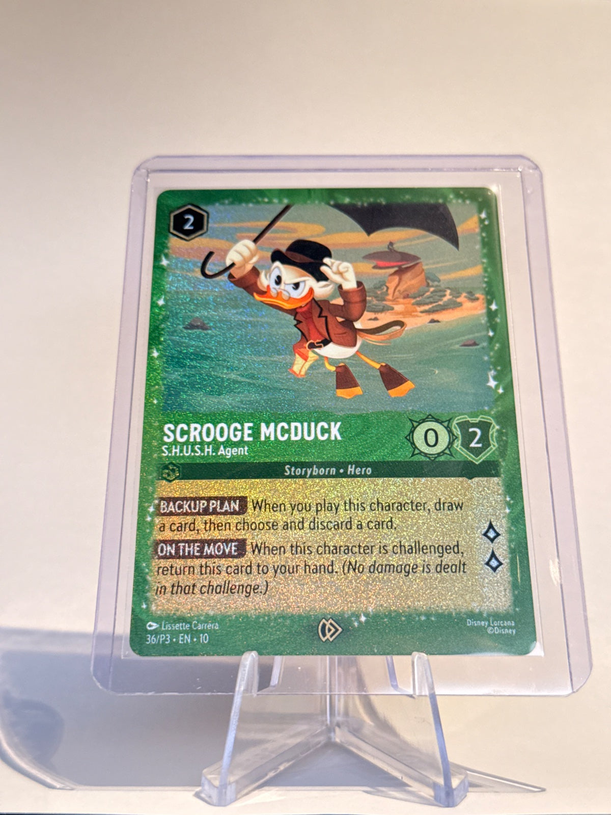 Disney Lorcana Scrooge McDuck – S.H.U.S.H. Agent #36/P3 Promo Holofoil