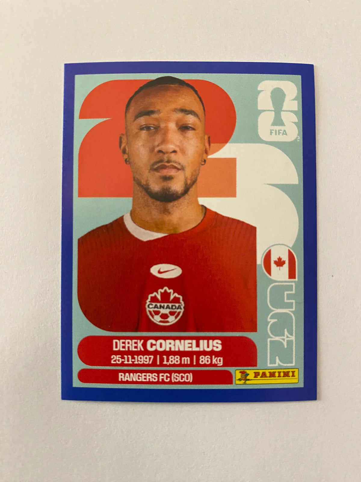 2026 Panini FIFA World Cup Stickers Blue Fronts w/ White Border - Blue #CAN7 Derek Cornelius