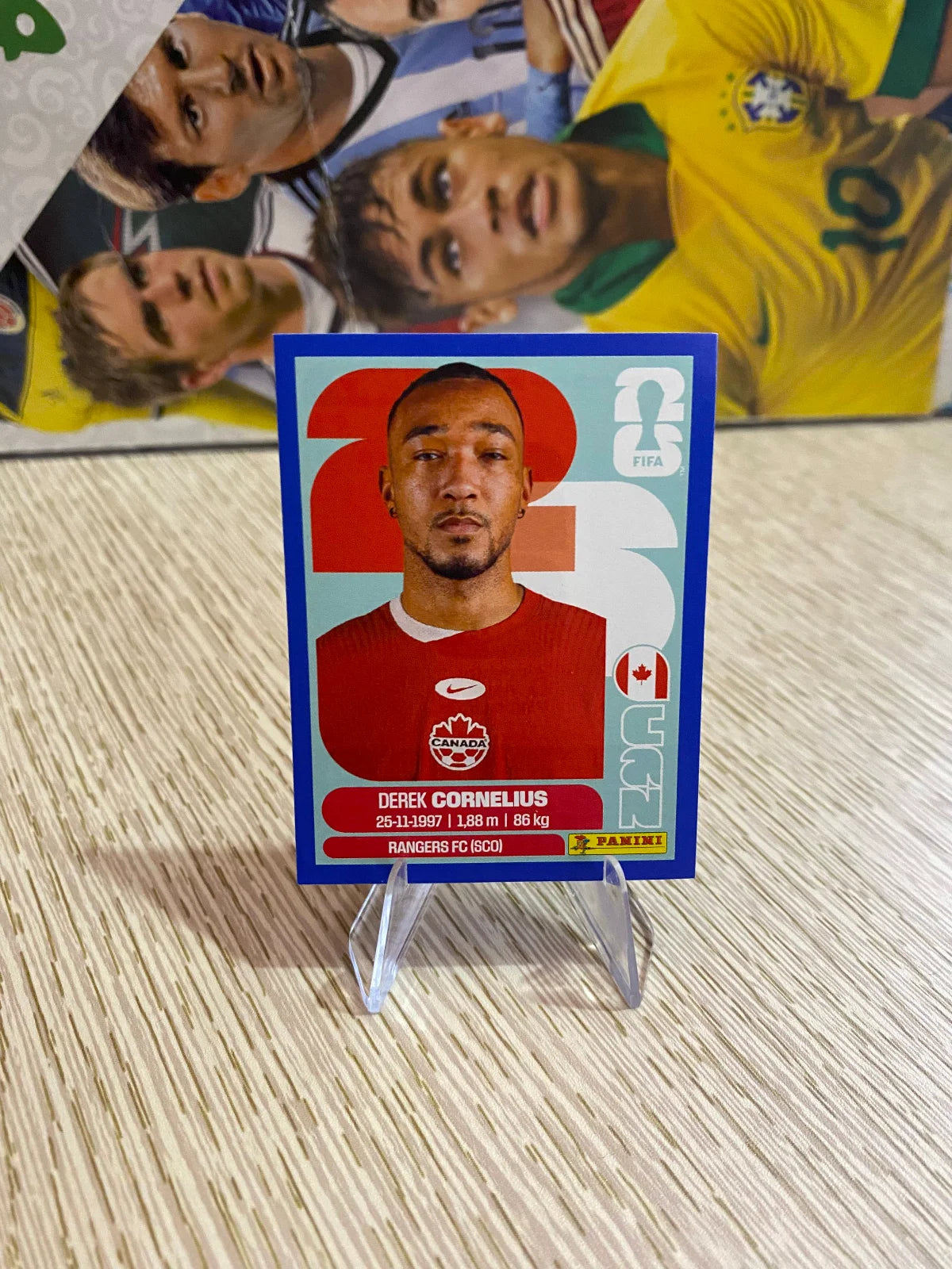 2026 Panini FIFA World Cup Stickers Blue Fronts w/ White Border - Blue #CAN7 Derek Cornelius