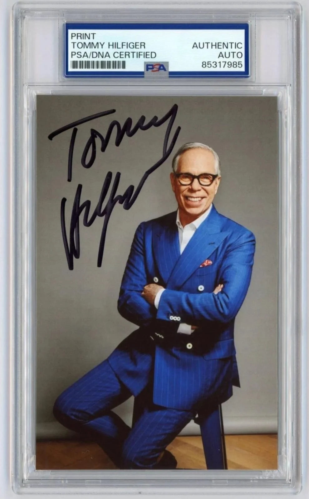 An authentic Tommy Hilfiger autographed photographic print, certified and encapsulated by PSA/DNA