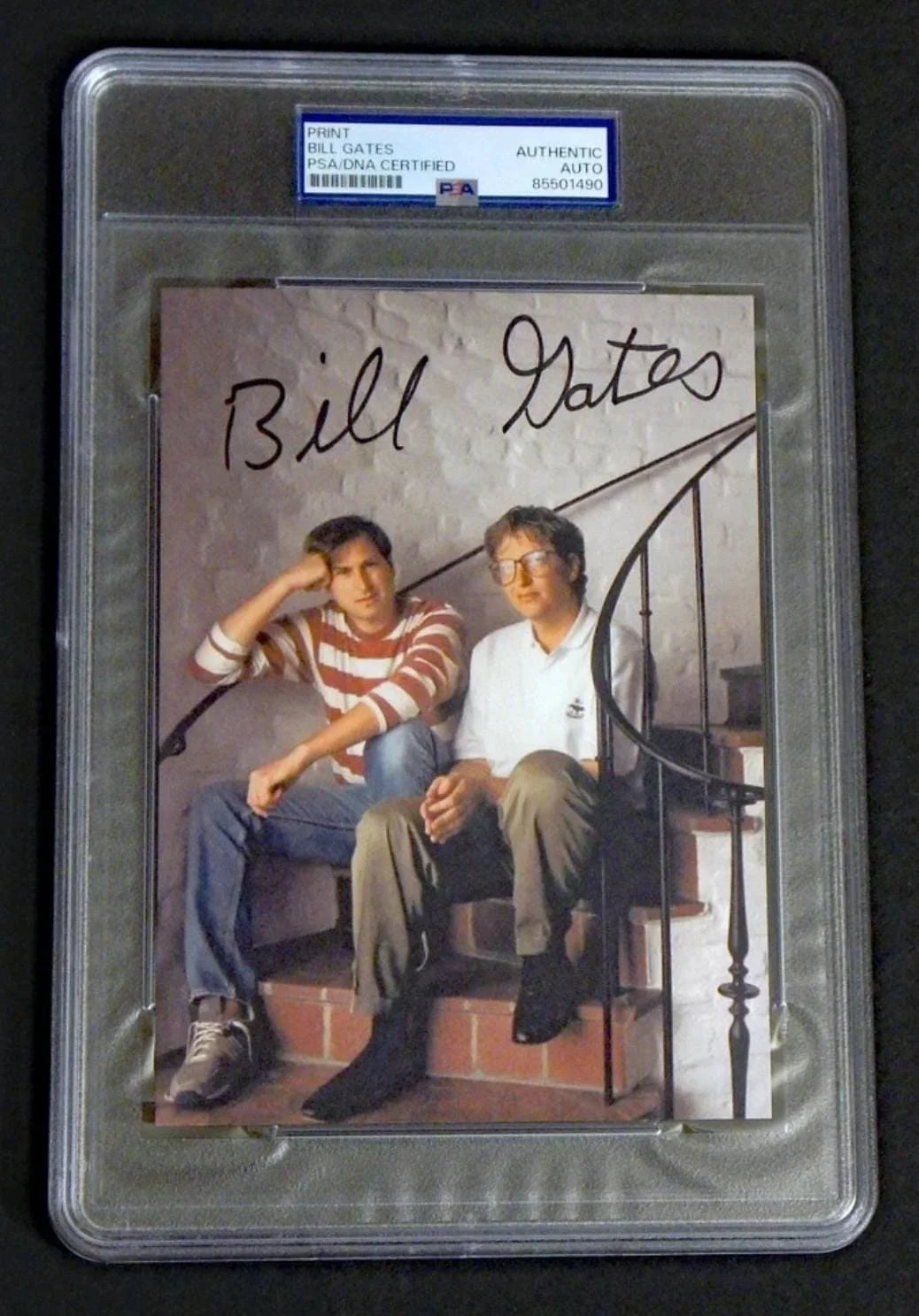 Signed photograph of Bill Gates seated alongside Steve Jobs. PSA/DNA-certified Bill Gates autograph