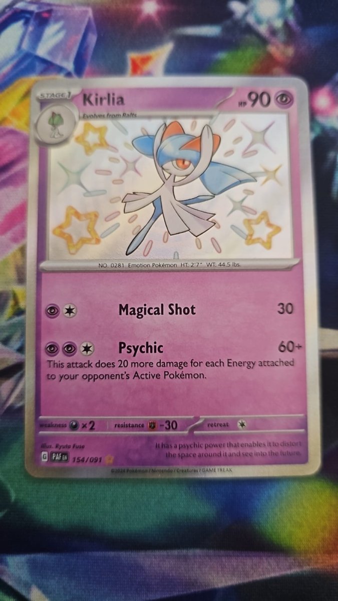 Kirlia 154/091 - Paldean Fates - Shiny Rare by Light Collectibles on MYNTED