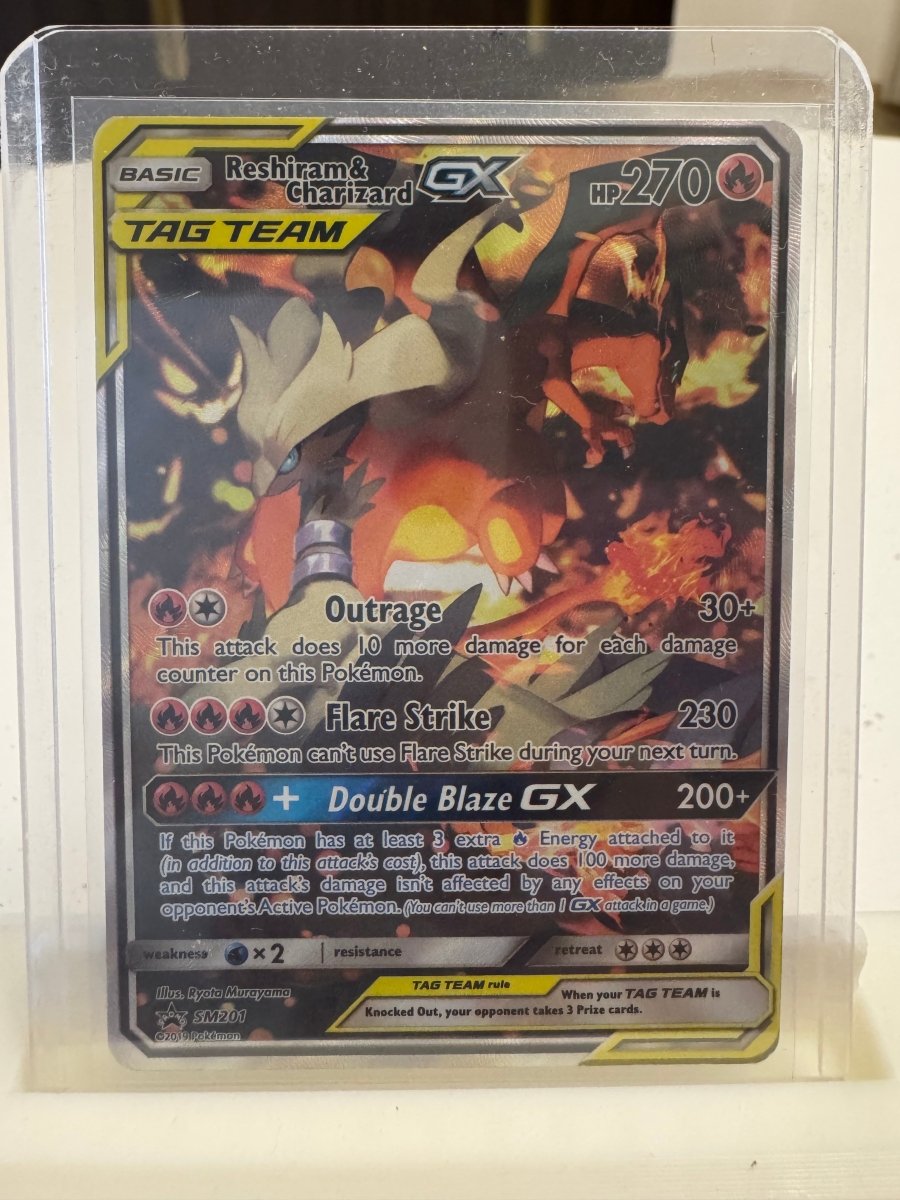 Reshiram & Charizard GX - SM201 Promo by The Archive Stop on MYNTED