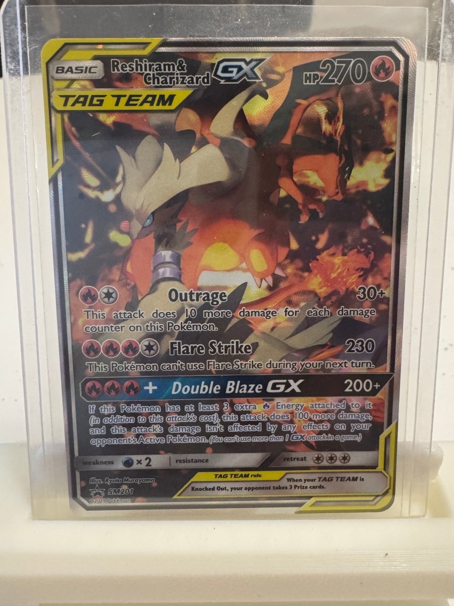 Reshiram & Charizard GX - SM201 Promo by The Archive Stop on MYNTED